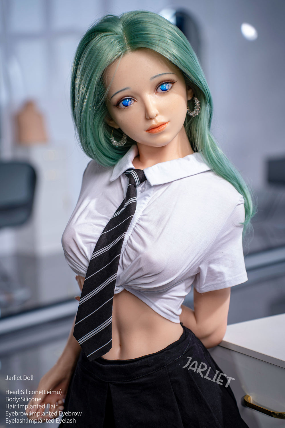 Doll with green hair and a white shirt with a black tie in a blurred indoor setting